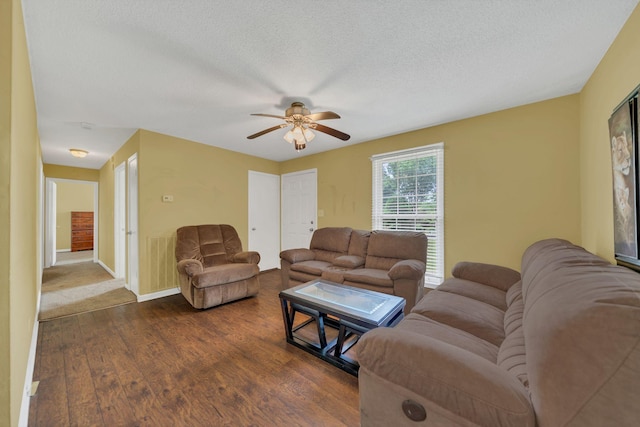 575 Cynthia Dr, Clarksville, TN 37042 - living area with dark wood-type flooring, ceiling fan, and a textured ceiling