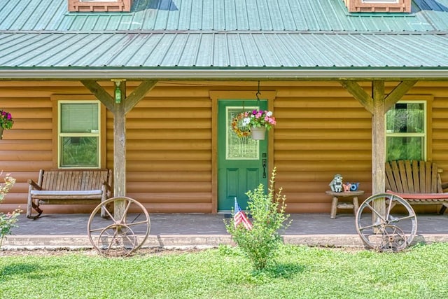1034 Gaw Branch Rd, Gainesboro, TN 38562 - view of exterior entry with log veneer siding and a metal roof