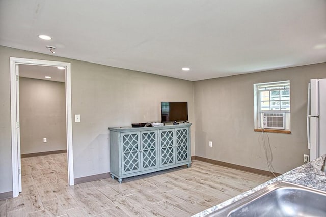 1034 Gaw Branch Rd, Gainesboro, TN 38562 - kitchen with light wood finished floors, cooling unit, recessed lighting, and freestanding refrigerator