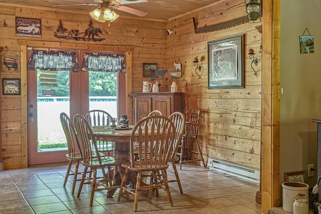 1034 Gaw Branch Rd, Gainesboro, TN 38562 - dining room featuring wooden walls, healthy amount of natural light, baseboard heating, ceiling fan, and french doors