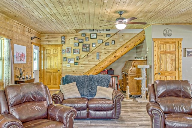 1034 Gaw Branch Rd, Gainesboro, TN 38562 - living area featuring a ceiling fan, wood ceiling, wood finished floors, and wood walls
