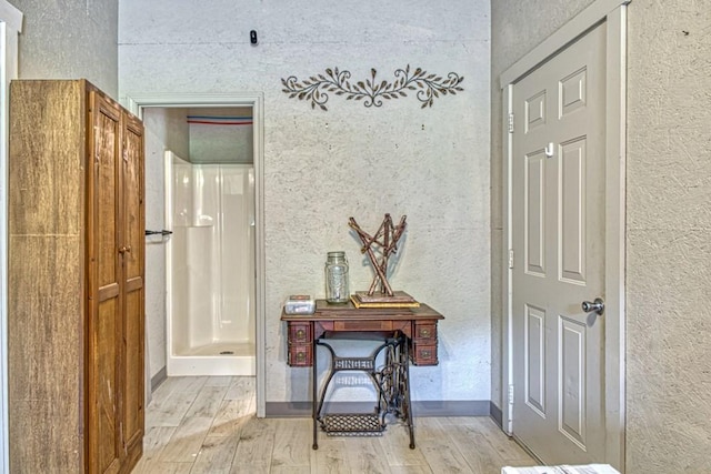 1034 Gaw Branch Rd, Gainesboro, TN 38562 - hallway featuring a textured wall and light wood-style floors