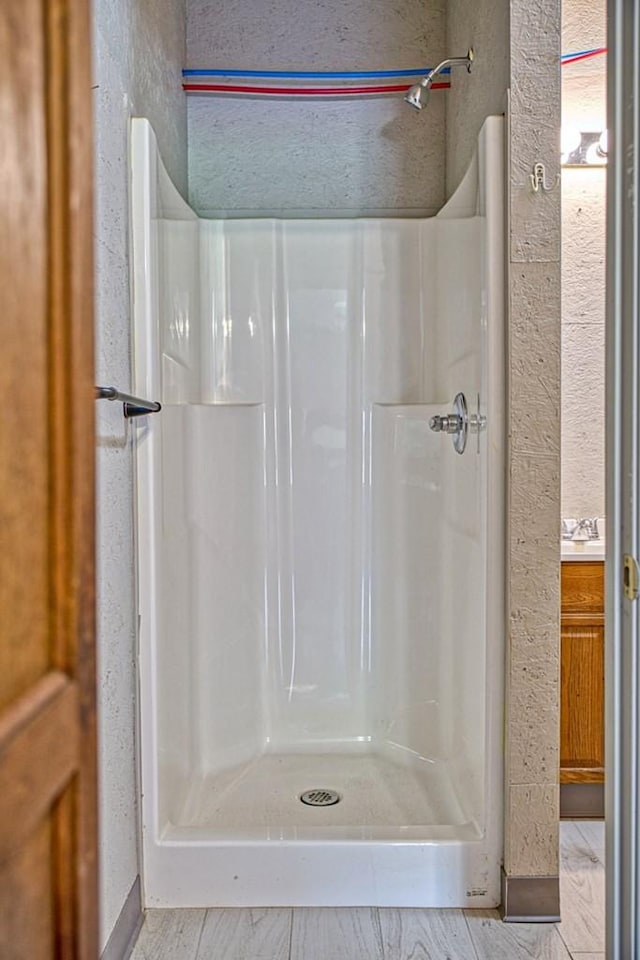 1034 Gaw Branch Rd, Gainesboro, TN 38562 - bathroom featuring a shower stall and a textured wall