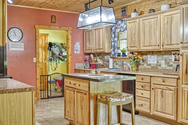 1034 Gaw Branch Rd, Gainesboro, TN 38562 - kitchen featuring stainless steel dishwasher, backsplash, ornamental molding, light brown cabinetry, and a kitchen island