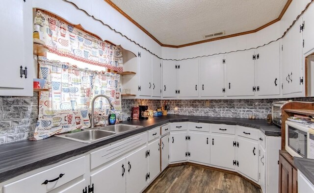 5011 Sunny Acres Dr, Waynesboro, TN 38485 - kitchen featuring dark countertops, a textured ceiling, open shelves, dark wood-style floors, and white cabinetry