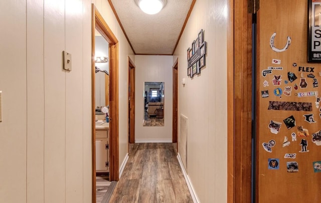 5011 Sunny Acres Dr, Waynesboro, TN 38485 - corridor with wood finished floors, a textured ceiling, and crown molding
