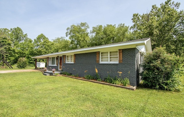 5011 Sunny Acres Dr, Waynesboro, TN 38485 - view of front of property with brick siding and a front lawn