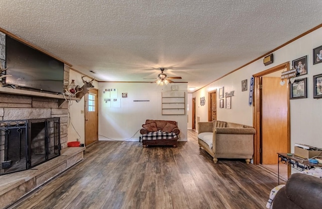 5011 Sunny Acres Dr, Waynesboro, TN 38485 - living area with crown molding, wood finished floors, a textured ceiling, ceiling fan, and a fireplace