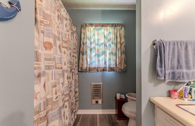5011 Sunny Acres Dr, Waynesboro, TN 38485 - full bath with heating unit, vanity, wood finished floors, and a shower with curtain