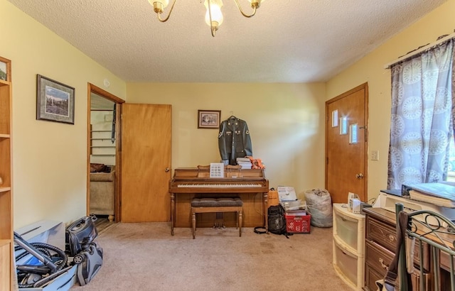 5011 Sunny Acres Dr, Waynesboro, TN 38485 - carpeted entryway with a textured ceiling and a chandelier