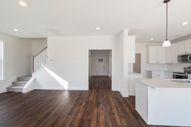 4016 Rampart Way, Spring Hill, TN 37174 - kitchen with stainless steel appliances, dark wood finished floors, light countertops, white cabinets, and recessed lighting