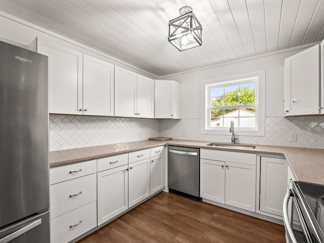 227 Shady Grove Rd, Manchester, TN 37355 - kitchen with appliances with stainless steel finishes, white cabinetry, tasteful backsplash, and wood ceiling