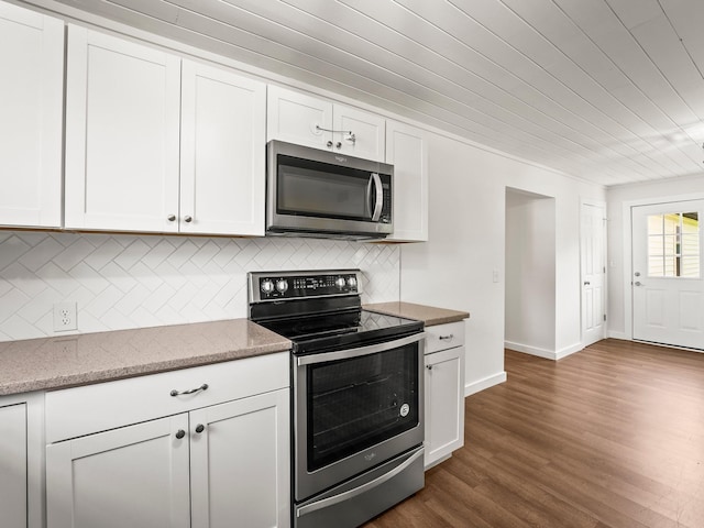 227 Shady Grove Rd, Manchester, TN 37355 - kitchen featuring stainless steel appliances, dark wood finished floors, white cabinets, light stone counters, and backsplash