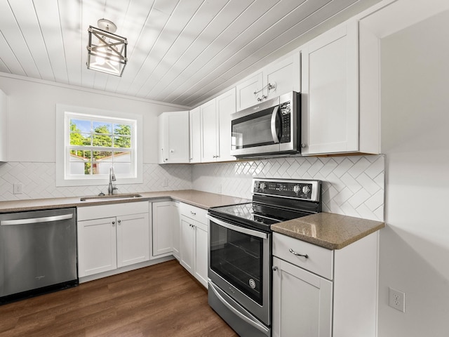 227 Shady Grove Rd, Manchester, TN 37355 - kitchen featuring appliances with stainless steel finishes, white cabinets, decorative backsplash, dark wood finished floors, and wood ceiling
