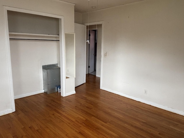 902 Mcarthur St, Manchester, TN 37355 - unfurnished bedroom featuring wood finished floors, a closet, and attic access