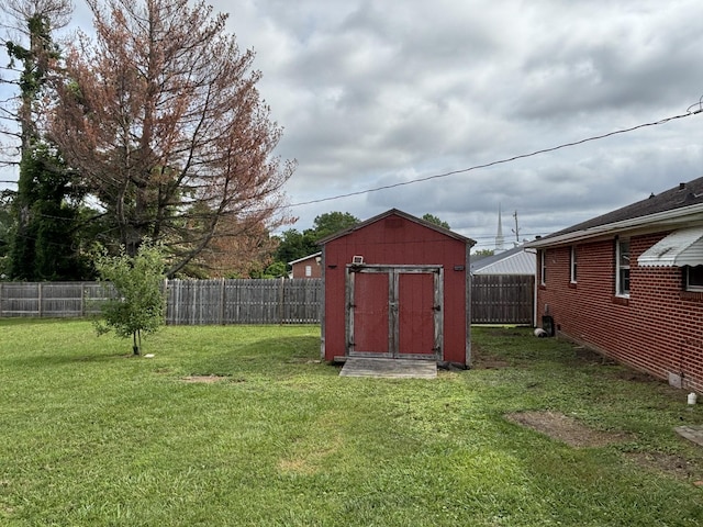 902 Mcarthur St, Manchester, TN 37355 - fenced backyard featuring a storage unit