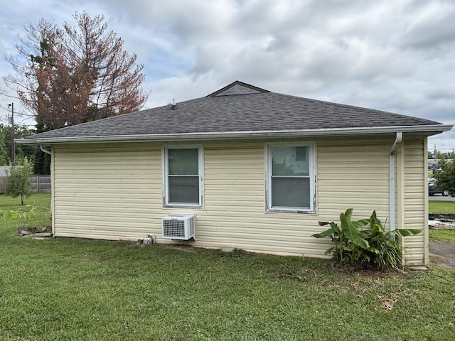 902 Mcarthur St, Manchester, TN 37355 - view of side of home featuring roof with shingles and a yard