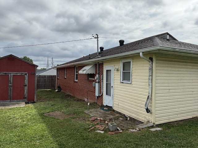 902 Mcarthur St, Manchester, TN 37355 - back of property with a shed and roof with shingles