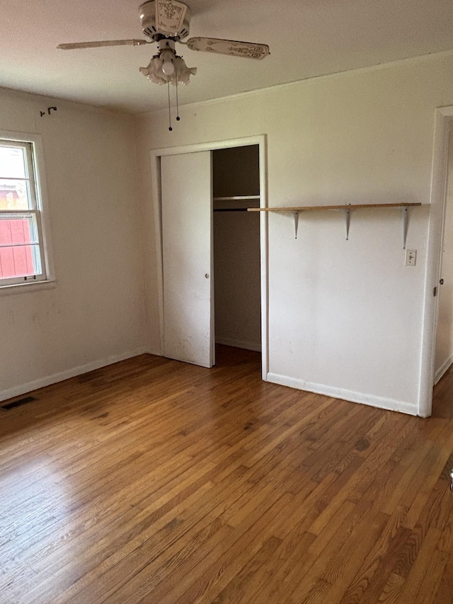 902 Mcarthur St, Manchester, TN 37355 - unfurnished bedroom featuring wood finished floors, a closet, and a ceiling fan
