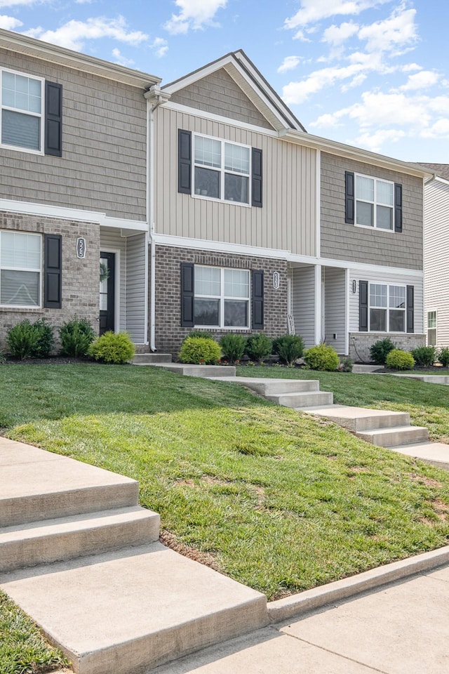 523 Moshe Flam Pl, La Vergne, TN 37086 - view of property featuring a front yard and brick siding