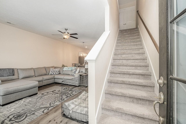 523 Moshe Flam Pl, La Vergne, TN 37086 - staircase with a ceiling fan and wood finished floors