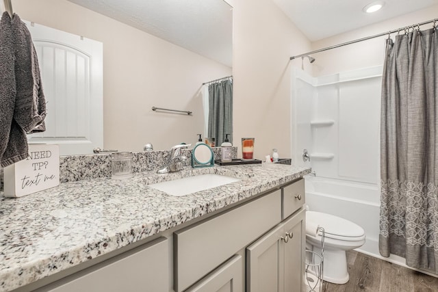 523 Moshe Flam Pl, La Vergne, TN 37086 - bathroom featuring vanity, wood finished floors, shower / tub combo, and recessed lighting