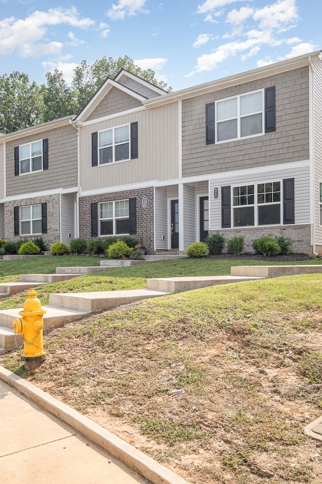 523 Moshe Flam Pl, La Vergne, TN 37086 - view of property with a front yard and brick siding