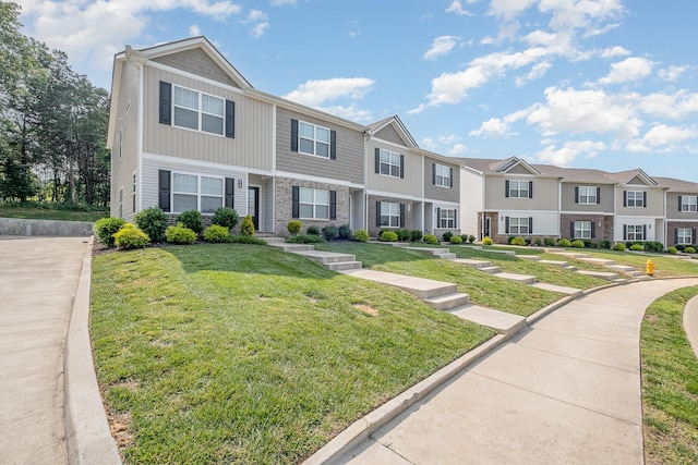 523 Moshe Flam Pl, La Vergne, TN 37086 - townhome / multi-family property with a residential view and a front yard