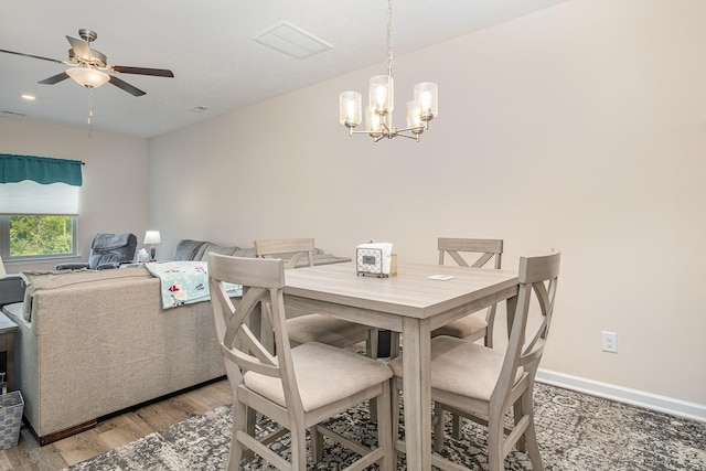 523 Moshe Flam Pl, La Vergne, TN 37086 - dining room featuring light wood-style flooring, a chandelier, and a ceiling fan