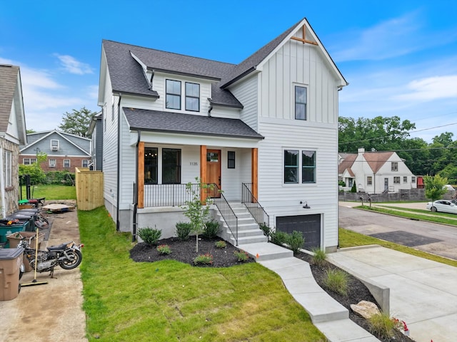1135 Delmas Ave, Nashville, TN 37216 - modern farmhouse style home with a garage, a porch, board and batten siding, driveway, and a shingled roof