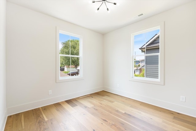 1135 Delmas Ave, Nashville, TN 37216 - empty room featuring a chandelier and light wood finished floors