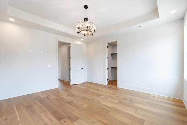 1135 Delmas Ave, Nashville, TN 37216 - empty room with a chandelier, recessed lighting, light wood finished floors, and a tray ceiling