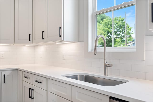1135 Delmas Ave, Nashville, TN 37216 - kitchen with plenty of natural light, decorative backsplash, and white cabinets