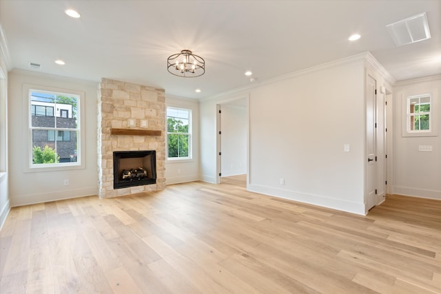 1135 Delmas Ave, Nashville, TN 37216 - unfurnished living room featuring ornamental molding, a chandelier, healthy amount of natural light, light wood finished floors, and recessed lighting