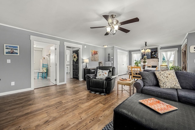 1036 Locke Creek Rd, Readyville, TN 37149 - living area featuring wood finished floors, a ceiling fan, crown molding, and a chandelier