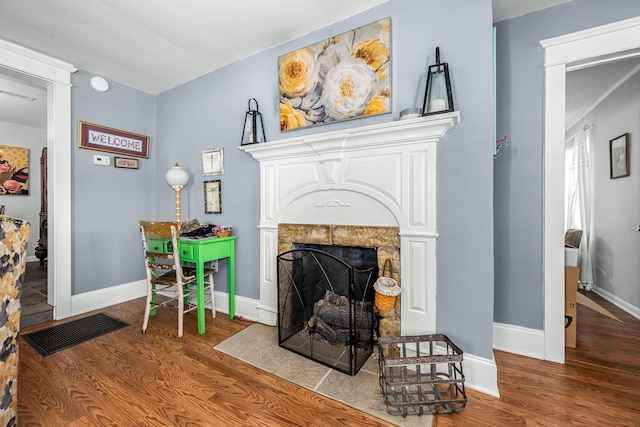 1036 Locke Creek Rd, Readyville, TN 37149 - living room featuring wood finished floors and a fireplace with flush hearth
