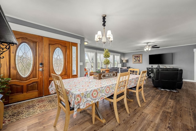 1036 Locke Creek Rd, Readyville, TN 37149 - dining area with a chandelier, dark wood-style flooring, a ceiling fan, and ornamental molding