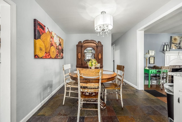 1036 Locke Creek Rd, Readyville, TN 37149 - dining area featuring stone tile floors and a chandelier