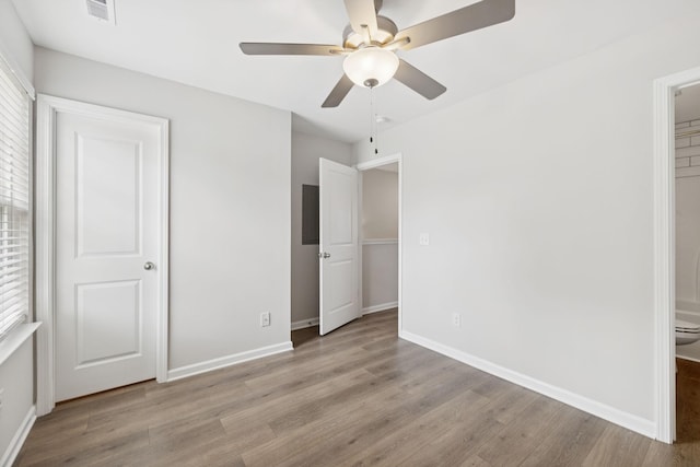 344 Kristen Ct, Columbia, TN 38401 - unfurnished bedroom with wood finished floors, ensuite bath, and a ceiling fan