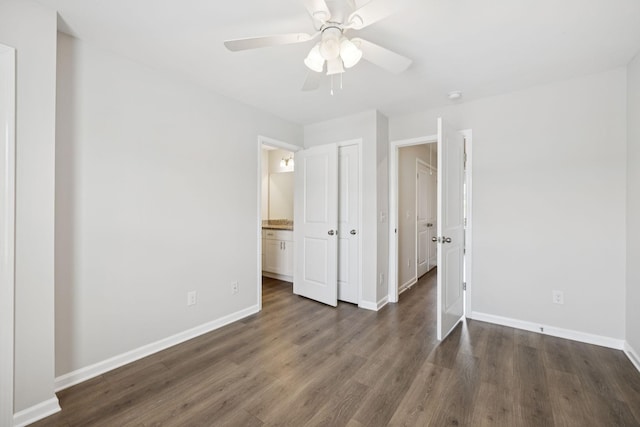 344 Kristen Ct, Columbia, TN 38401 - unfurnished bedroom featuring dark wood-style flooring, a ceiling fan, and connected bathroom