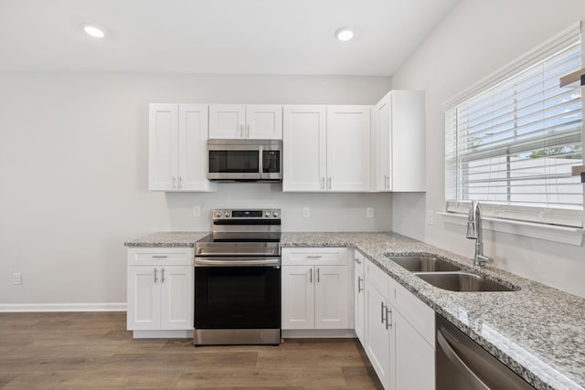 344 Kristen Ct, Columbia, TN 38401 - kitchen featuring stainless steel appliances, white cabinets, light stone counters, and recessed lighting
