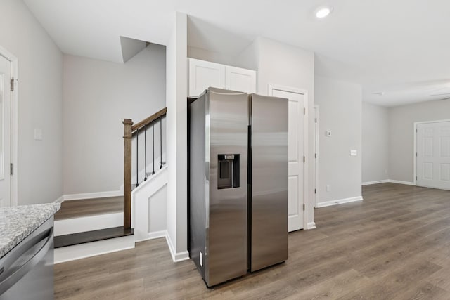 344 Kristen Ct, Columbia, TN 38401 - kitchen with stainless steel appliances, white cabinetry, light wood-type flooring, light stone countertops, and recessed lighting