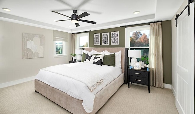 26 Cowan Ct, Mount Juliet, TN 37122 - bedroom with light carpet, a barn door, a tray ceiling, a ceiling fan, and recessed lighting