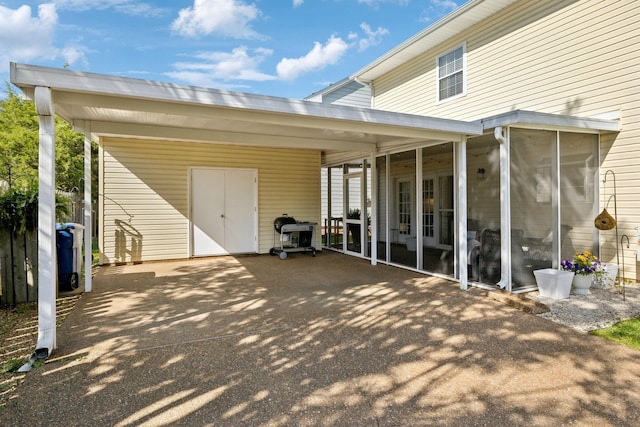 2016 Roderick Cir, Franklin, TN 37064 - view of patio / terrace featuring a sunroom, an attached carport, and driveway