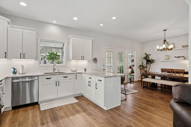 2016 Roderick Cir, Franklin, TN 37064 - kitchen featuring stainless steel dishwasher, a peninsula, healthy amount of natural light, white cabinets, and recessed lighting
