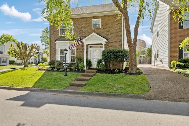 2016 Roderick Cir, Franklin, TN 37064 - traditional-style house with brick siding, driveway, a front yard, and a residential view
