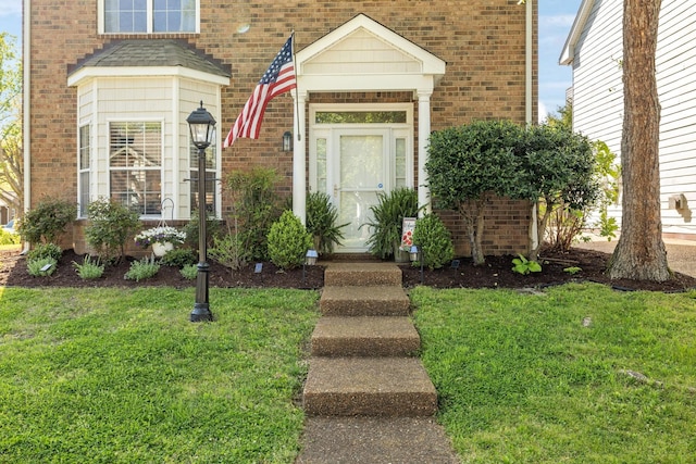 2016 Roderick Cir, Franklin, TN 37064 - view of exterior entry featuring brick siding and a lawn