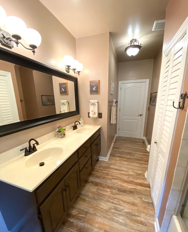 2214 Henpeck Ln, Franklin, TN 37064 - full bath featuring wood finished floors, double vanity, and a closet