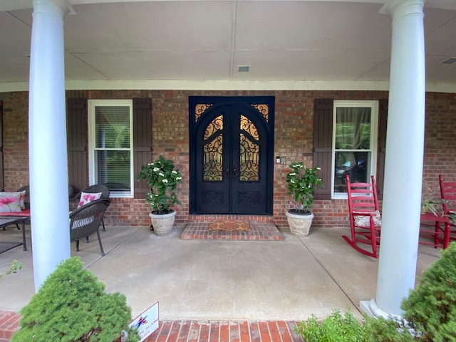 2214 Henpeck Ln, Franklin, TN 37064 - doorway to property with a porch, brick siding, and french doors