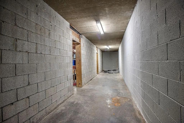 2214 Henpeck Ln, Franklin, TN 37064 - corridor with concrete flooring and concrete block wall